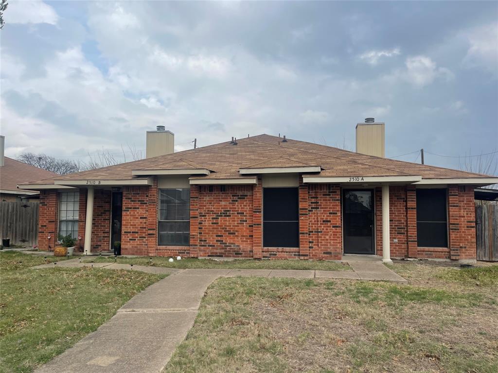 2510 Stanford Street, Unit A Rowlett, TX 75088 - Photo 1 of 11 a front view of a house with a garden