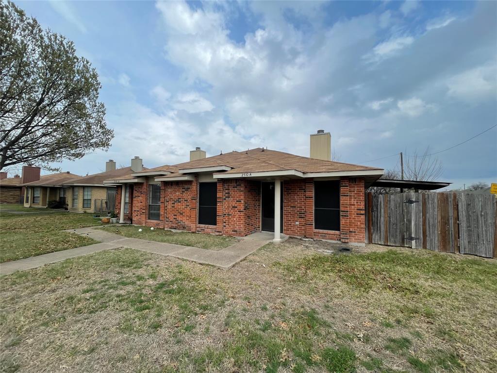 2510 Stanford Street, Unit A Rowlett, TX 75088 - Photo 2 of 11 a front view of a house with a yard