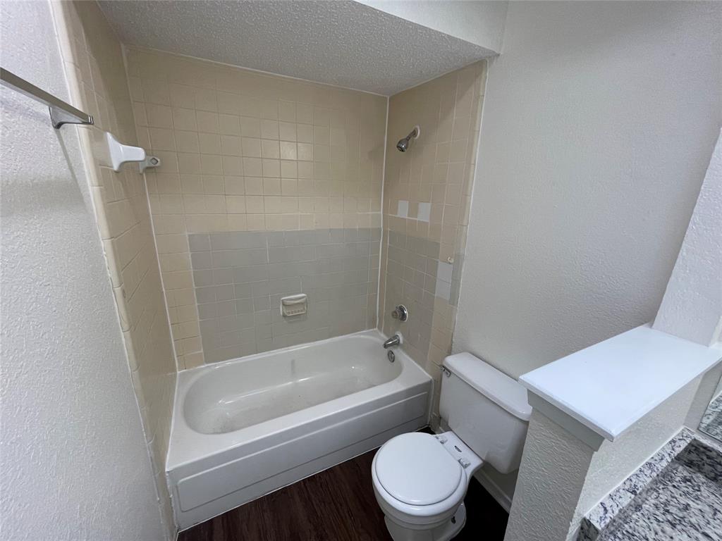 2510 Stanford Street, Unit A Rowlett, TX 75088 - Photo 10 of 11 a bathroom with a toilet and a bathtub