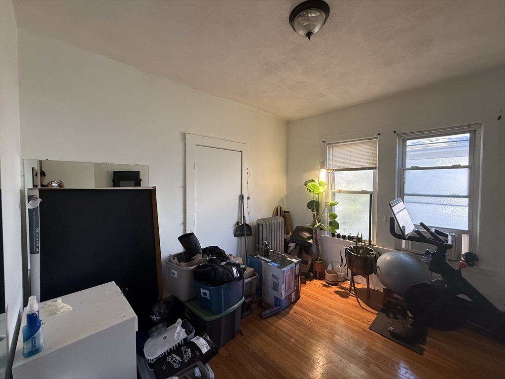 107 Bloomfield Street, Unit 3 Boston, MA 02124 - Photo 11 of 14 a living room with furniture