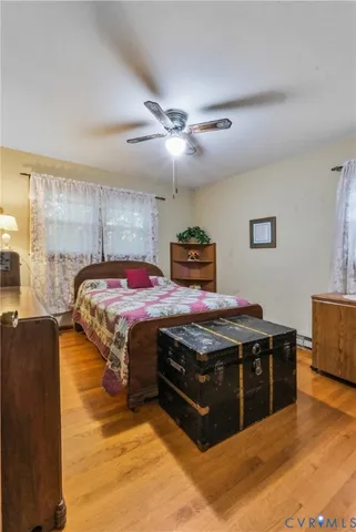 a bed sitting in a kitchen next to a window