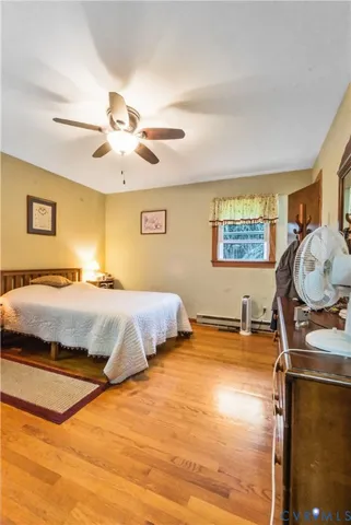 a bedroom with bed and window