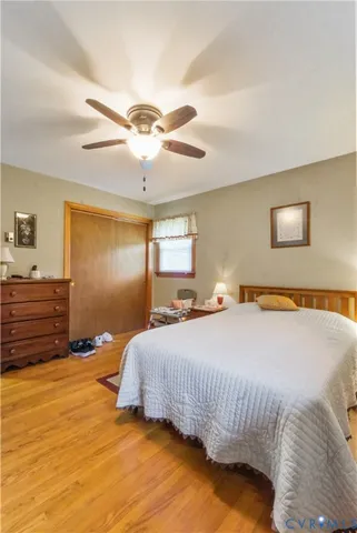 a bedroom with a bed and dresser