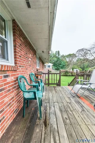 a view of house with deck outdoor seating and city view