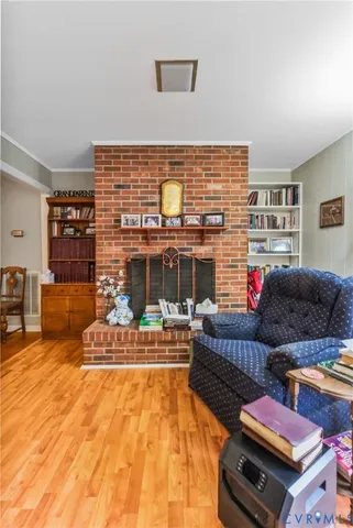 a living room with furniture fireplace and a table