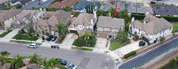 an aerial view of multiple houses with yard