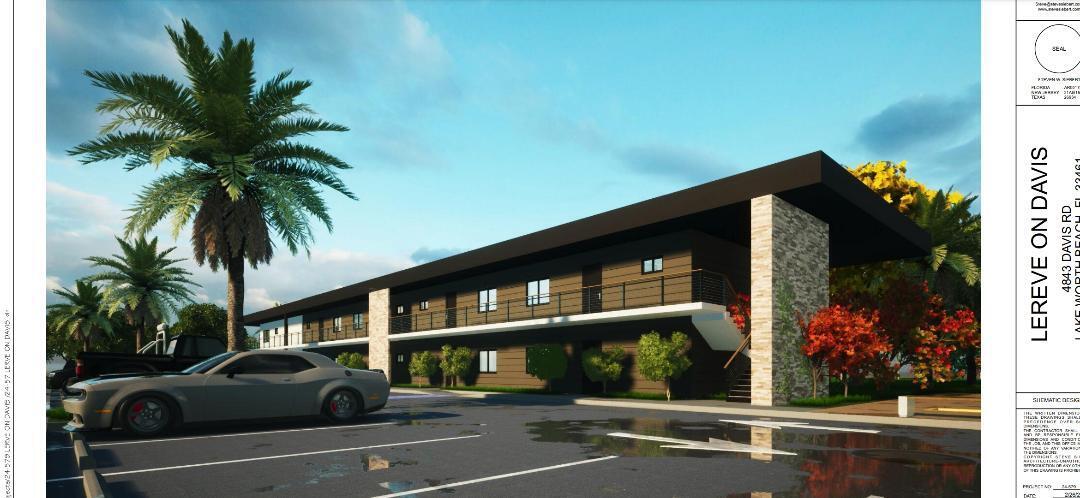 a view of multiple houses with a street