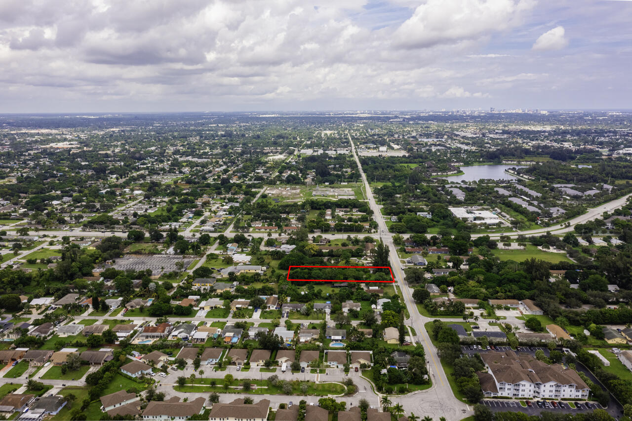 4843 Davis Road Lake Worth, FL 33461 - Photo 11 of 18 an aerial view of residential building with green space