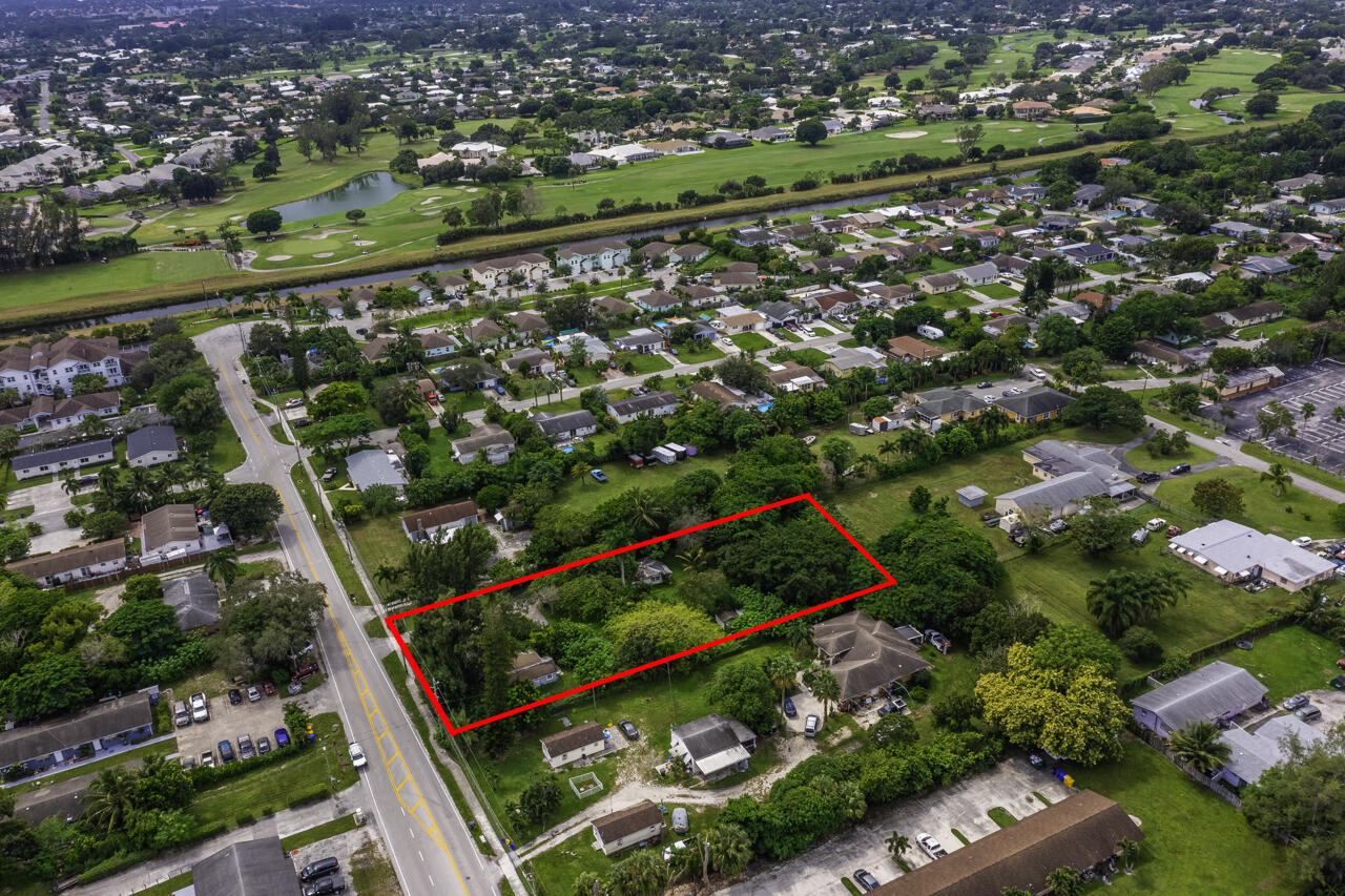 4843 Davis Road Lake Worth, FL 33461 - Photo 16 of 18 an aerial view of a city