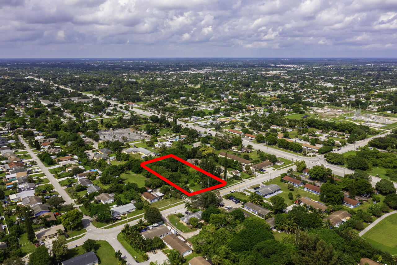 4843 Davis Road Lake Worth, FL 33461 - Photo 9 of 18 an aerial view of multiple house