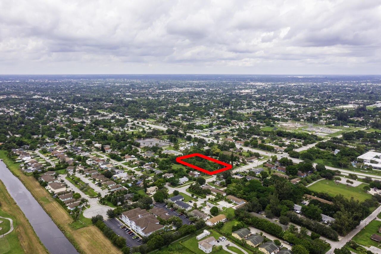 4843 Davis Road Lake Worth, FL 33461 - Photo 10 of 18 an aerial view of residential houses with city and outdoor space