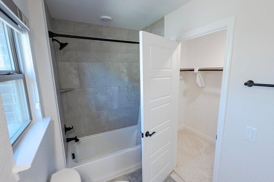 14561 Elion Court Pilot Point, TX 76258 - Photo 11 of 36 Full bath featuring washtub / shower combination and a spacious closet