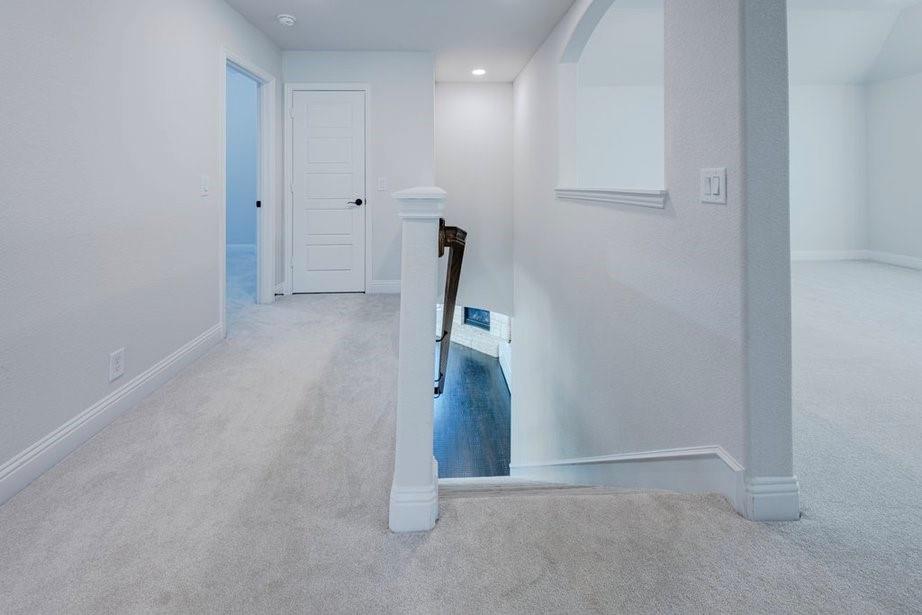 14561 Elion Court Pilot Point, TX 76258 - Photo 14 of 36 Corridor with light colored carpet, an upstairs landing, and recessed lighting