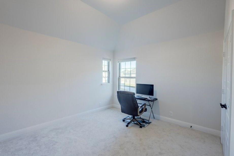 14561 Elion Court Pilot Point, TX 76258 - Photo 19 of 36 Carpeted office with baseboards and lofted ceiling