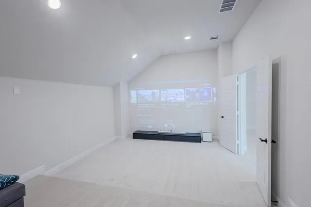 a view of a livingroom with a ceiling fan and window