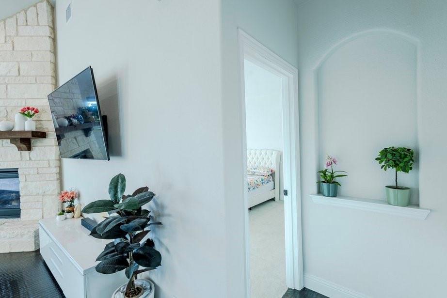14561 Elion Court Pilot Point, TX 76258 - Photo 23 of 36 Hallway featuring dark colored carpet