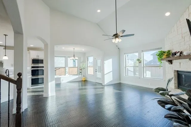 a kitchen with sink and mirror