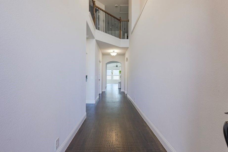 14561 Elion Court Pilot Point, TX 76258 - Photo 31 of 36 Hall featuring a high ceiling and arched walkways