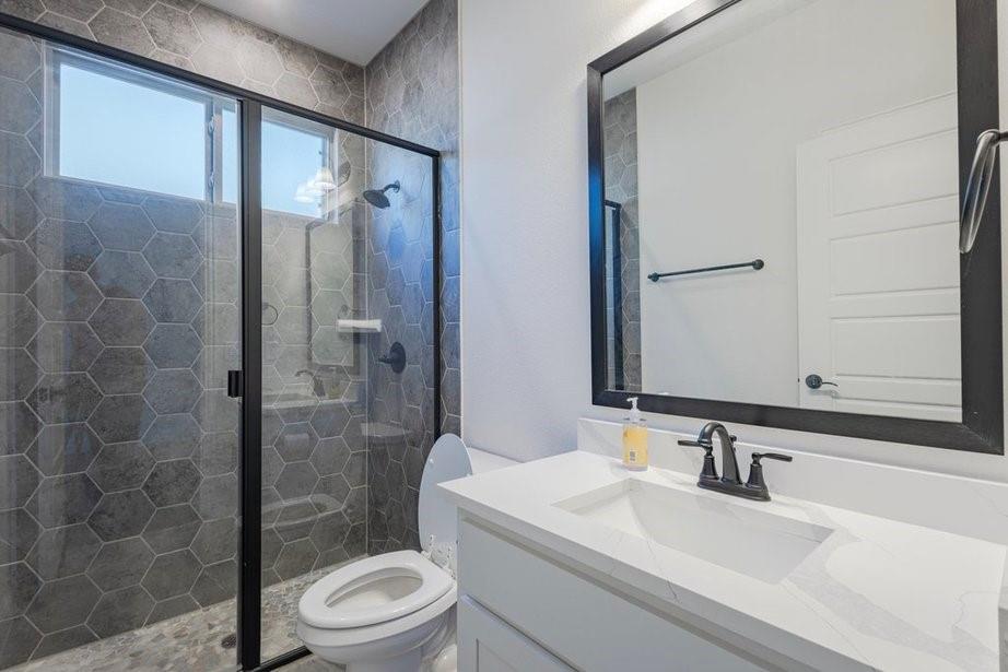 14561 Elion Court Pilot Point, TX 76258 - Photo 33 of 36 Full bathroom featuring a shower stall and vanity