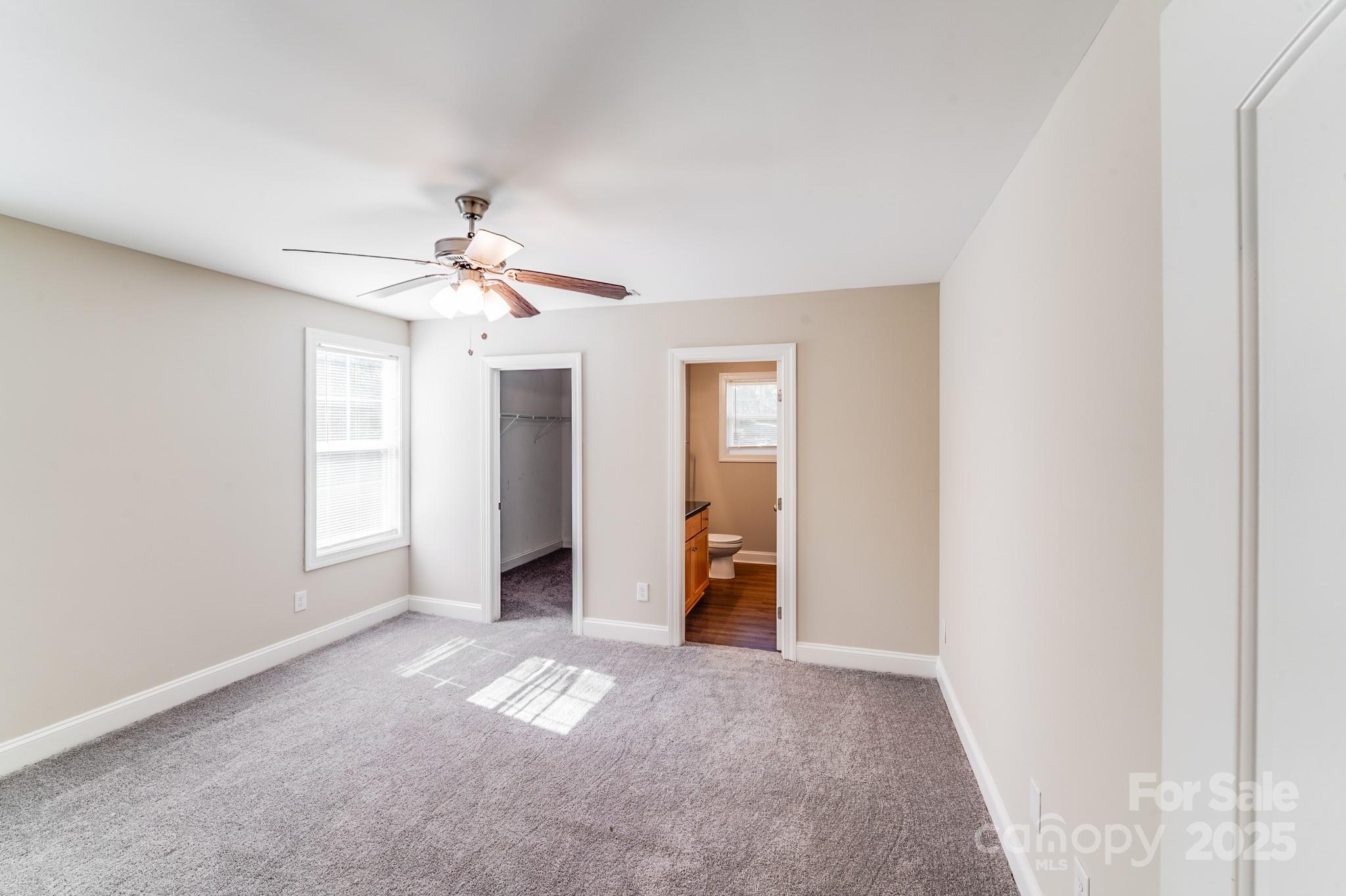 3133 Roberta Road Concord, NC 28027 - Photo 14 of 22 a view of a livingroom with a ceiling fan and window