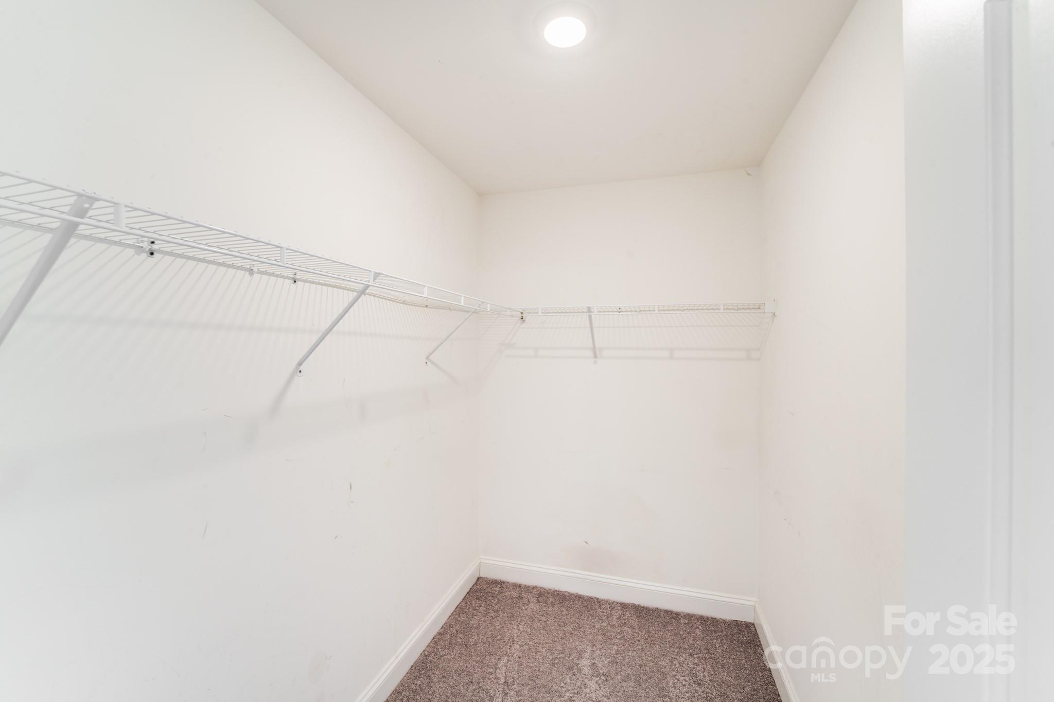 3133 Roberta Road Concord, NC 28027 - Photo 15 of 22 a view of a room with racks on the wall