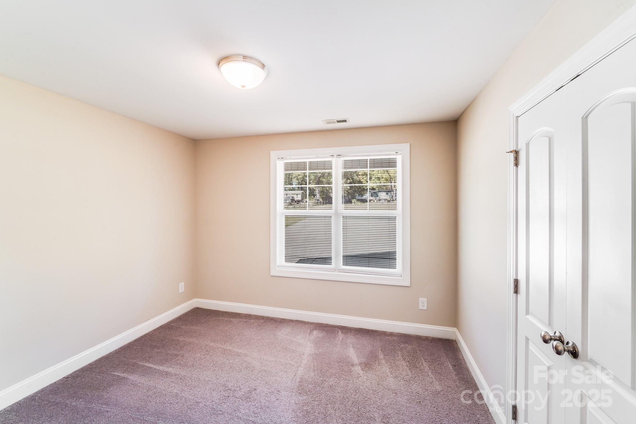 3133 Roberta Road Concord, NC 28027 - Photo 18 of 22 an empty room with a window