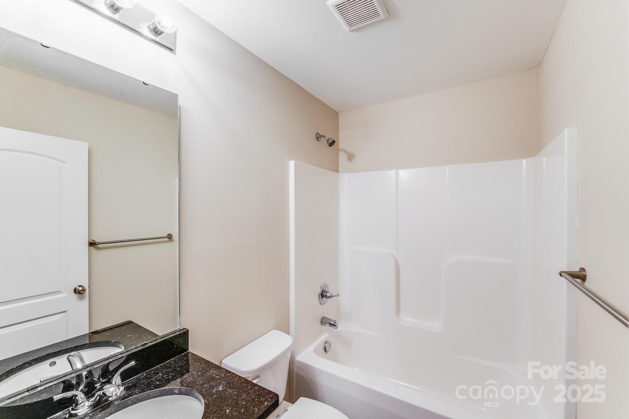 3133 Roberta Road Concord, NC 28027 - Photo 19 of 22 a bathroom with a sink toilet and shower