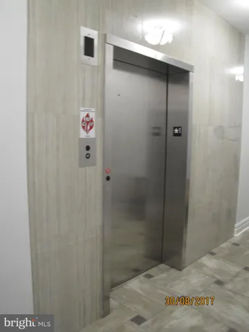 a bathroom with a shower and a sink