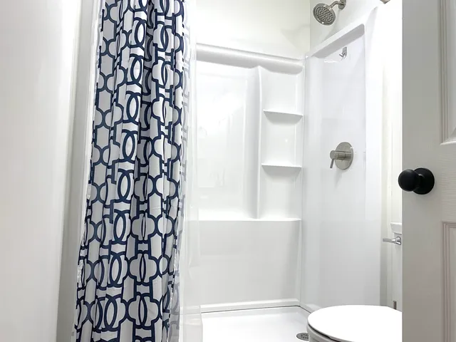 a bathroom with a shower curtain