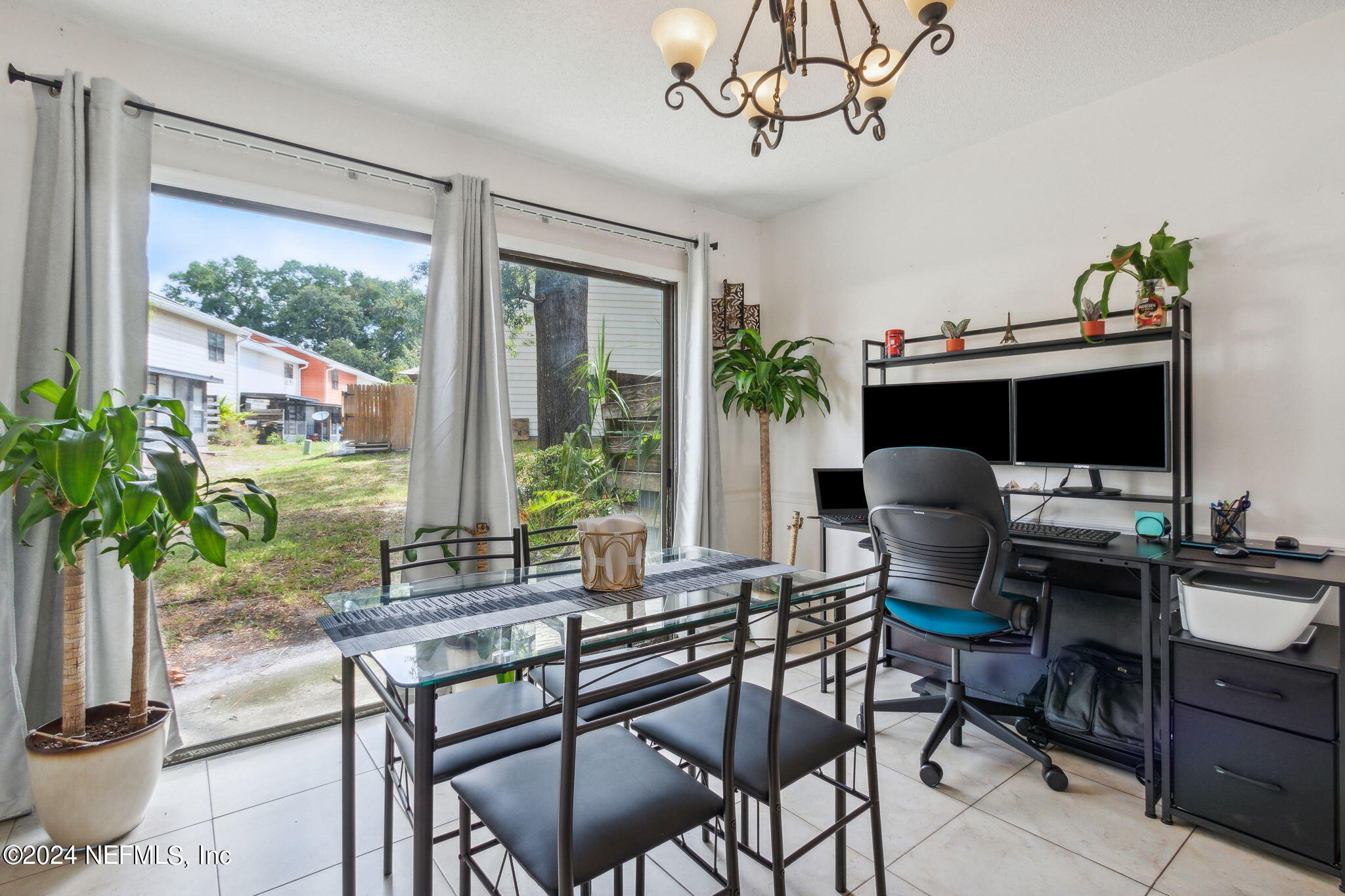 1004 Kettering Way Orange Park, FL 32073 - Photo 13 of 29 a work room with furniture and a potted plant