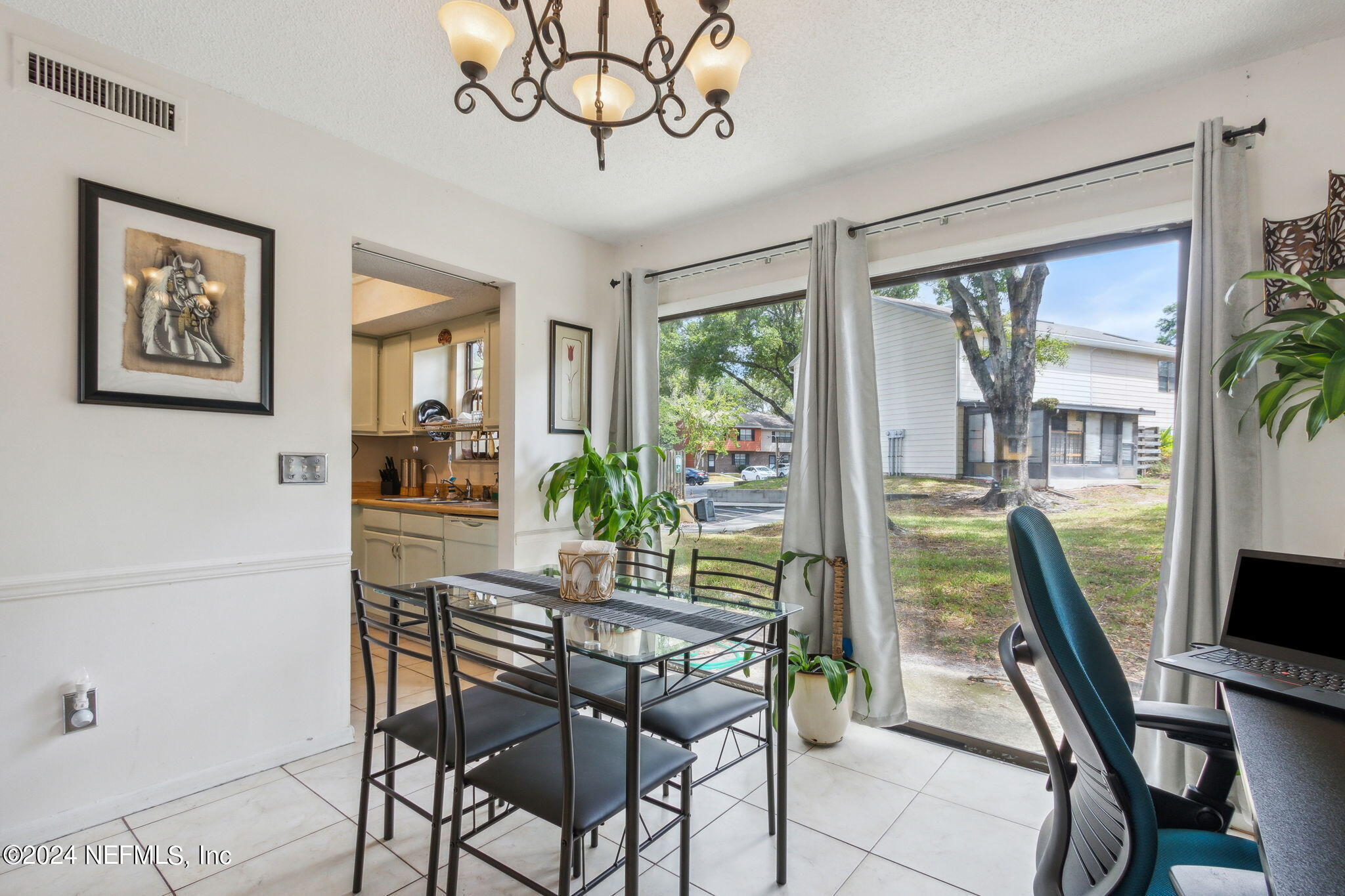 1004 Kettering Way Orange Park, FL 32073 - Photo 14 of 29 a view of a dining room with furniture window and outside view