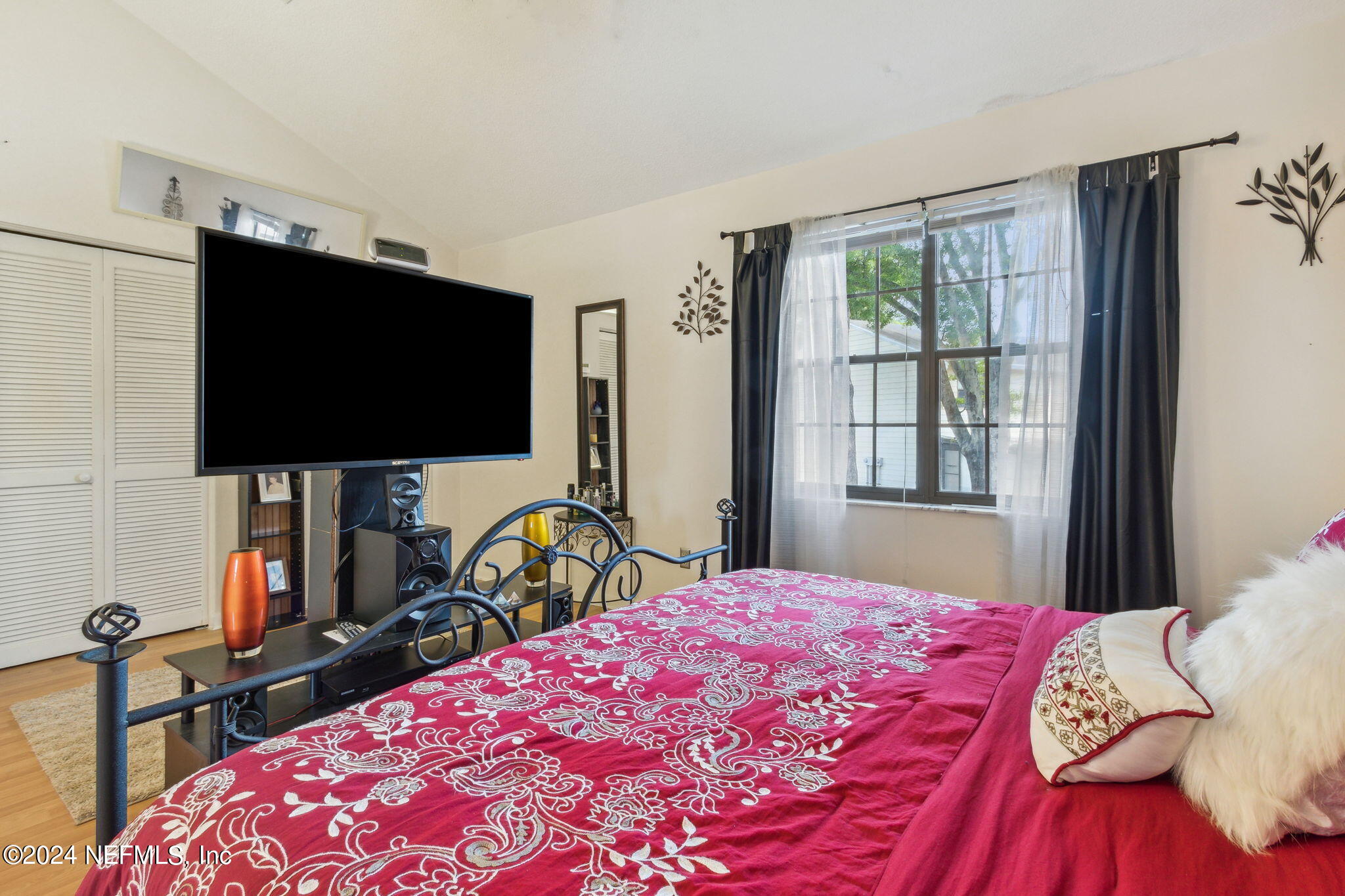 1004 Kettering Way Orange Park, FL 32073 - Photo 16 of 29 a bedroom with a bed and flat screen tv