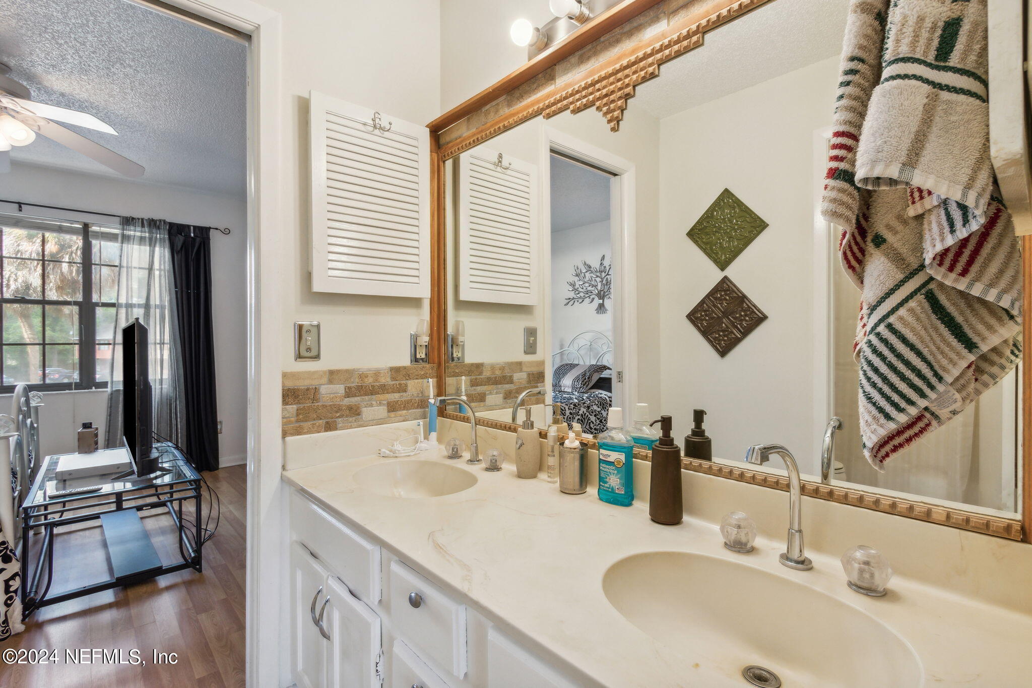 1004 Kettering Way Orange Park, FL 32073 - Photo 20 of 29 a bathroom with a sink and a mirror