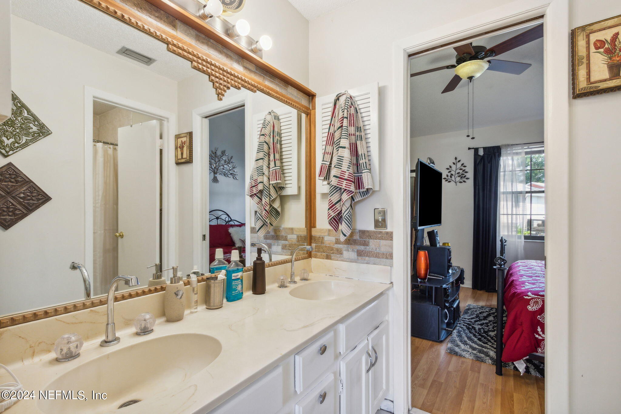 1004 Kettering Way Orange Park, FL 32073 - Photo 21 of 29 a bathroom with a double vanity sink and a mirror