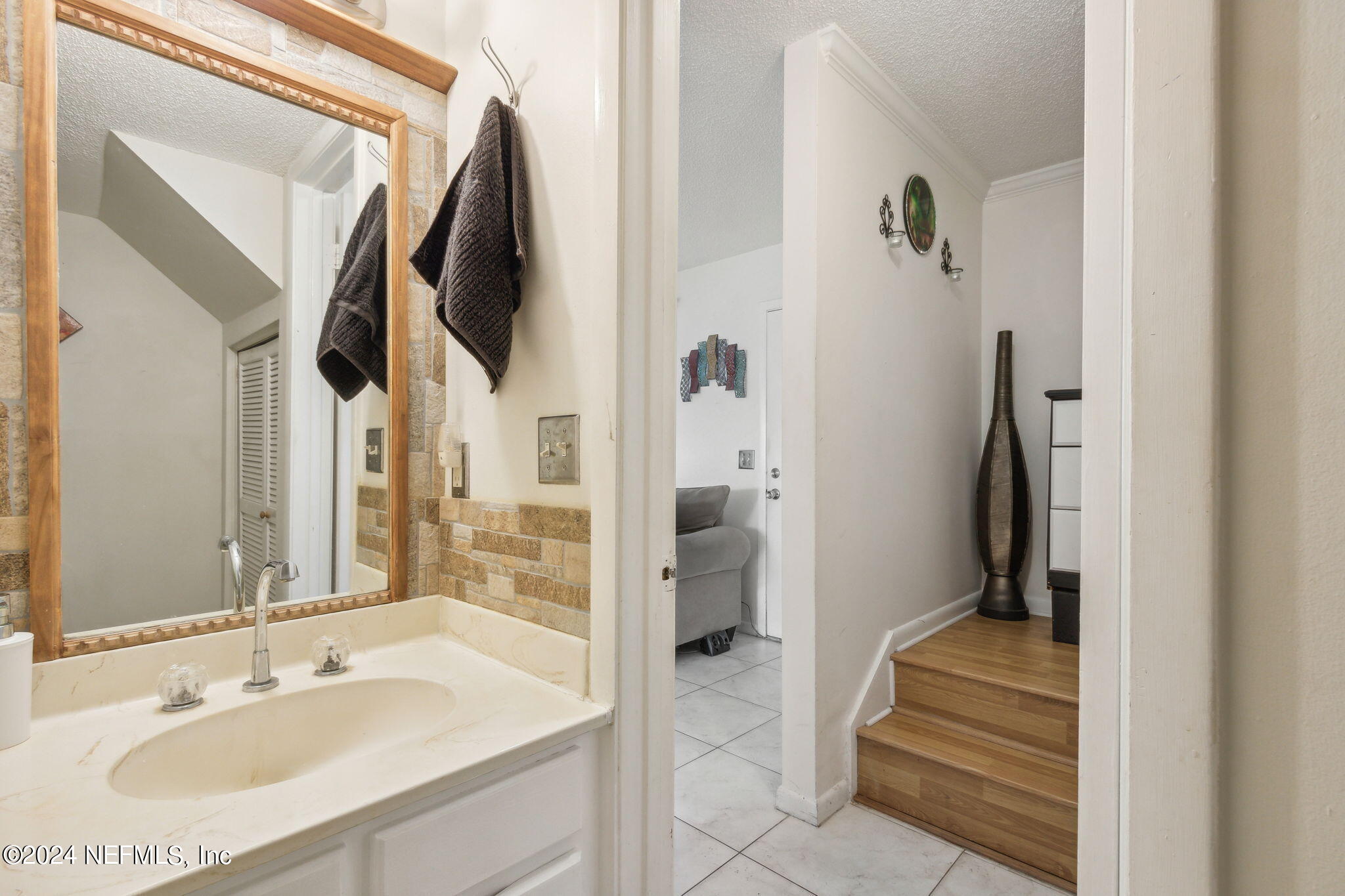 1004 Kettering Way Orange Park, FL 32073 - Photo 24 of 29 a bathroom with a sink and mirror