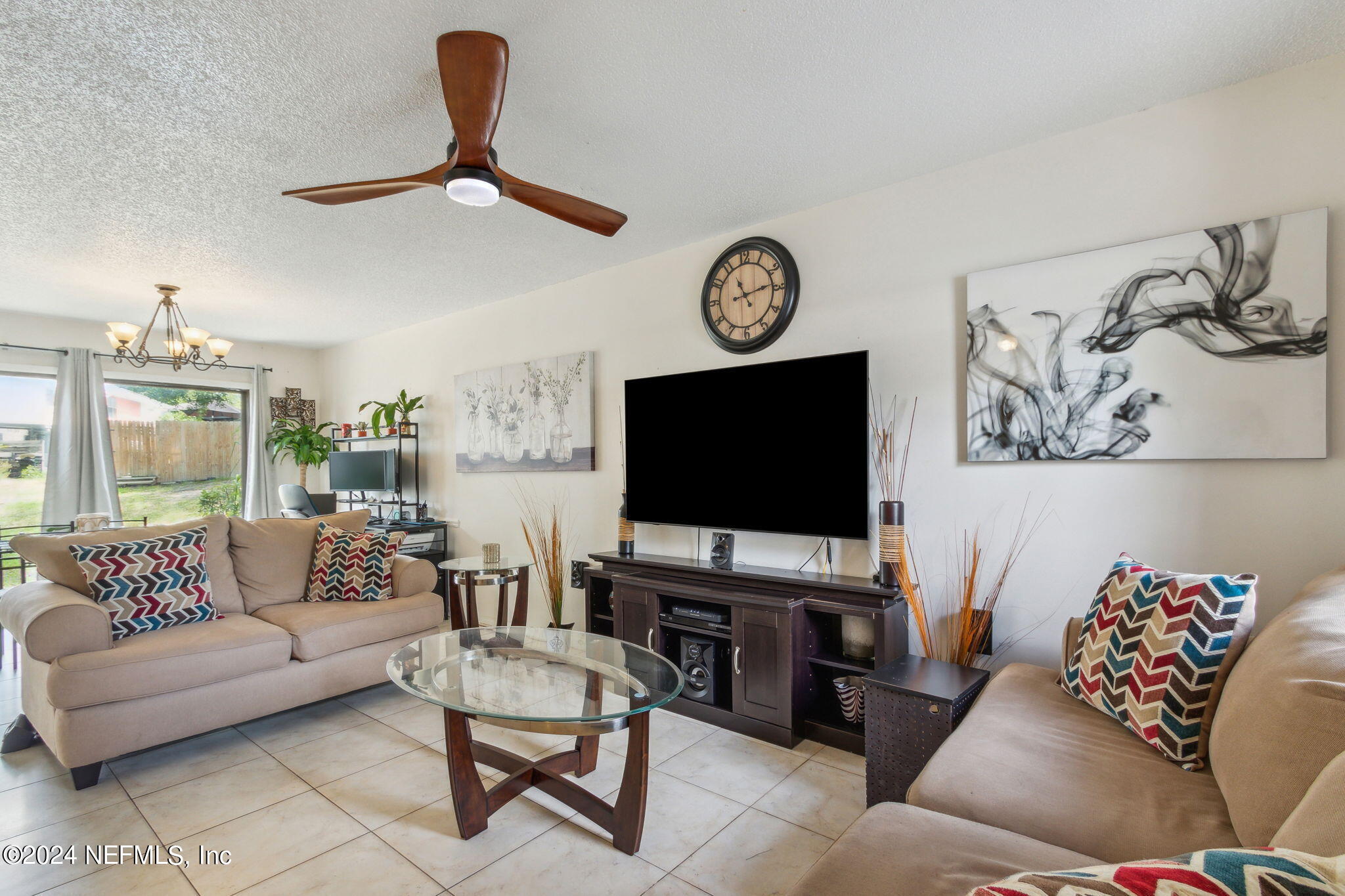 1004 Kettering Way Orange Park, FL 32073 - Photo 3 of 29 a living room with furniture and a flat screen tv