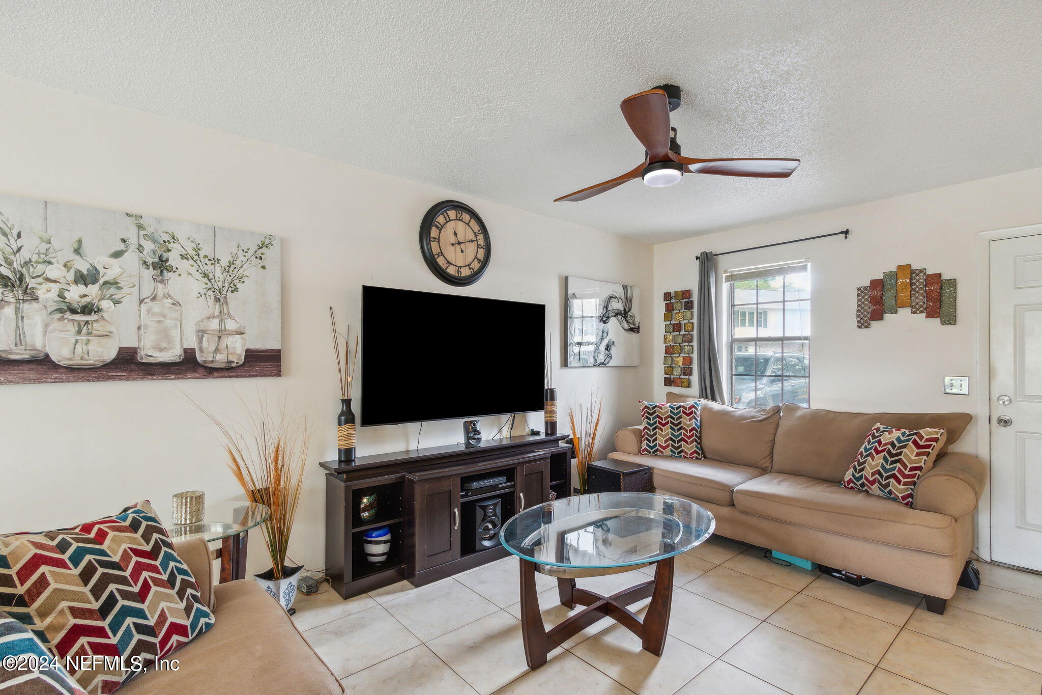 1004 Kettering Way Orange Park, FL 32073 - Photo 4 of 29 a living room with furniture and a flat screen tv