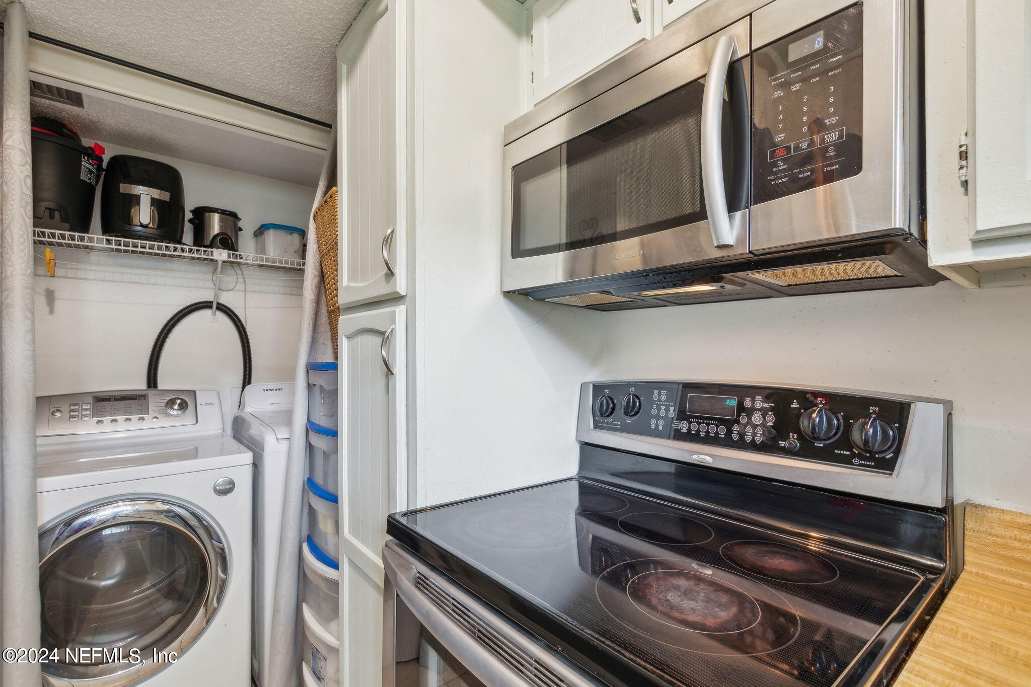 1004 Kettering Way Orange Park, FL 32073 - Photo 9 of 29 a kitchen with a stove and a microwave