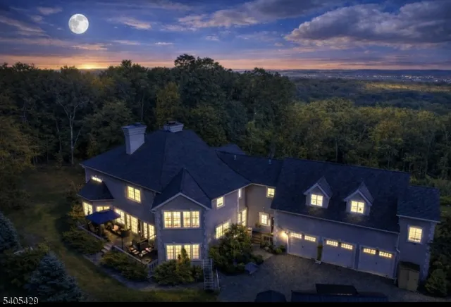 a front view of a house with a garden and plants