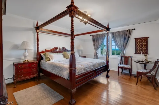 a front view of a house with a yard and potted plants