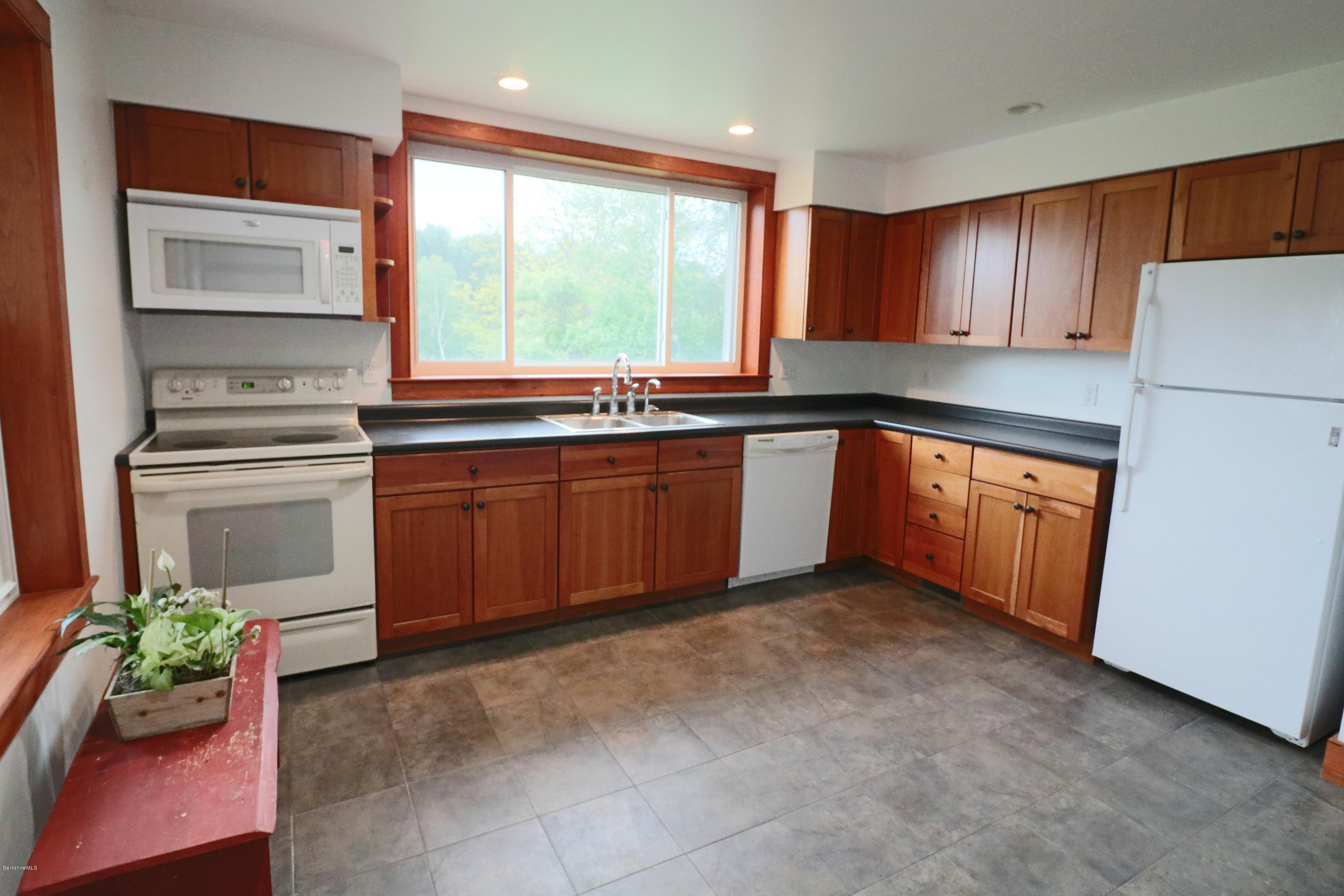 209 State Road Richmond, MA 01201 - Photo 8 of 38 a kitchen with stainless steel appliances granite countertop a refrigerator sink and cabinets