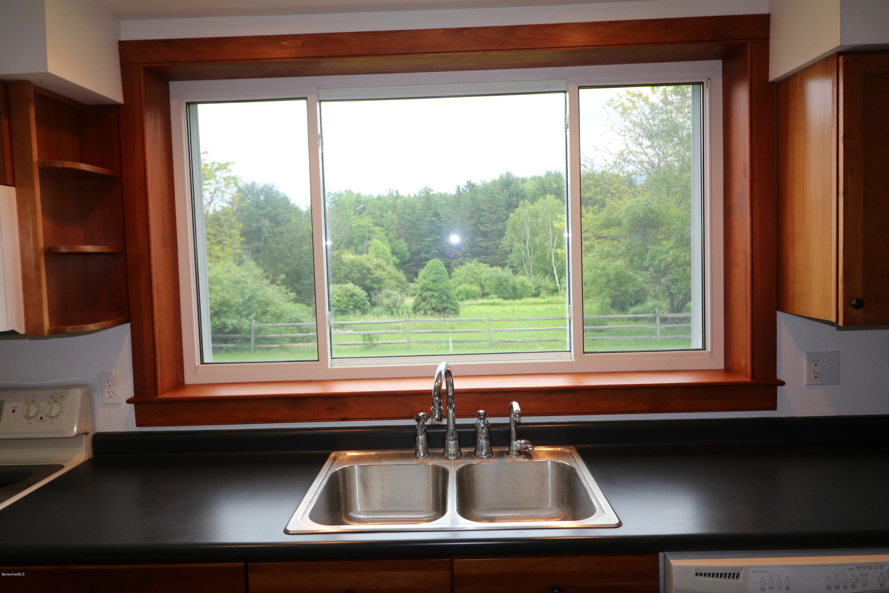 209 State Road Richmond, MA 01201 - Photo 9 of 38 a room with a large window and a bed