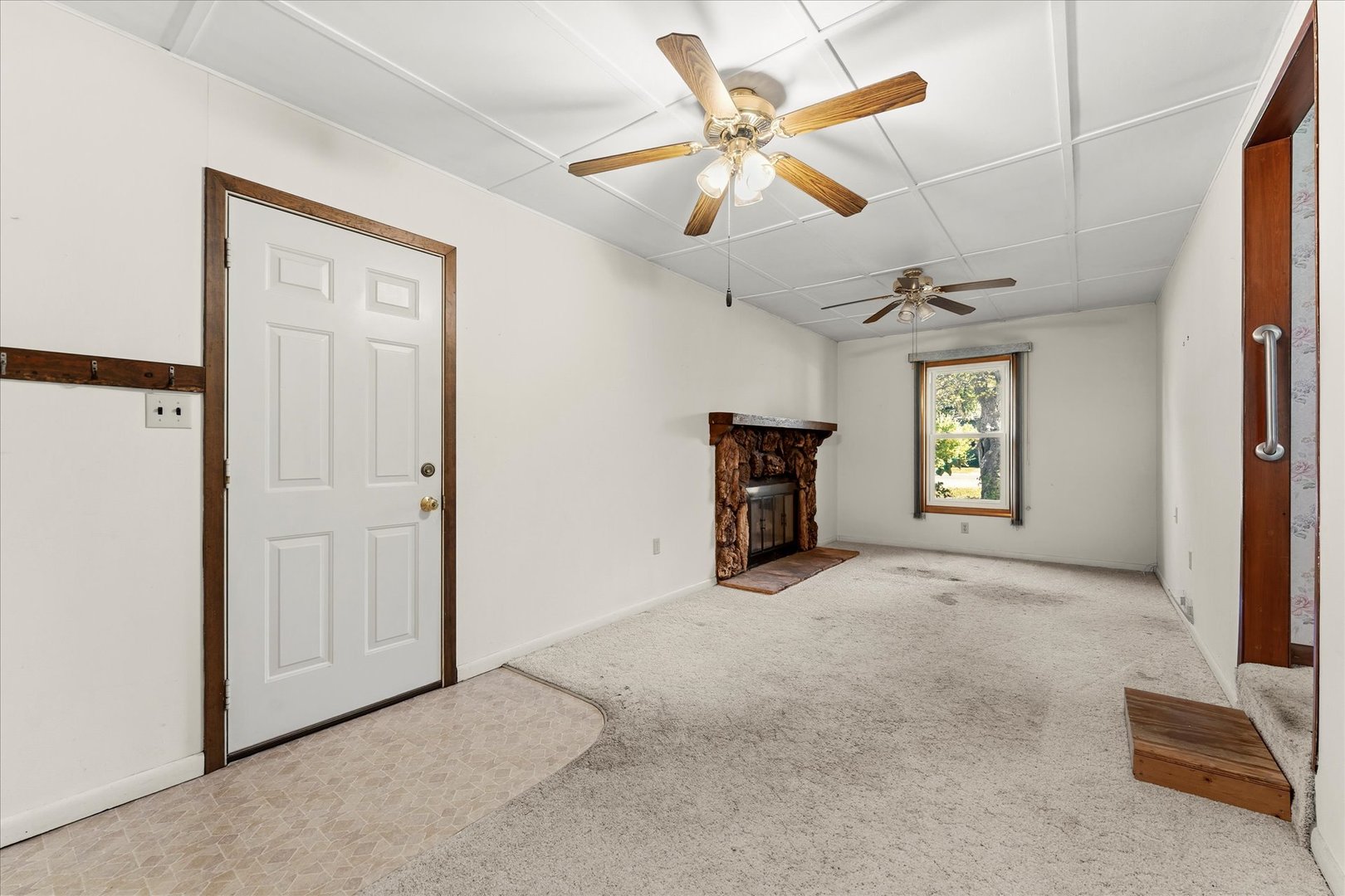 211 South Main Street Argenta, IL 62501 - Photo 14 of 32 an empty room with chandelier fan and windows