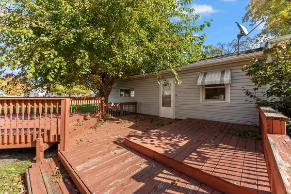 a view of backyard with a deck