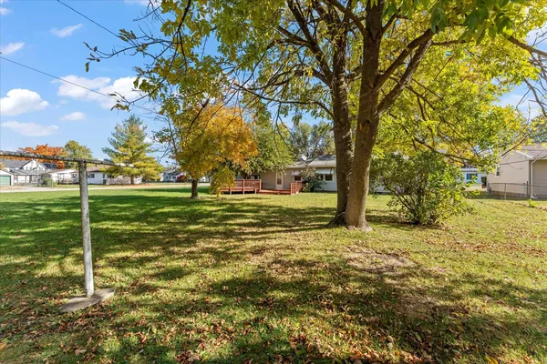 a view of a trees with a yard
