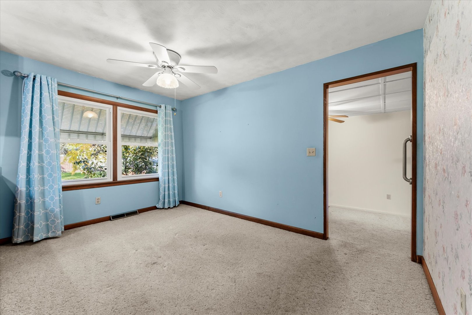 211 South Main Street Argenta, IL 62501 - Photo 9 of 32 an empty room with windows and fan