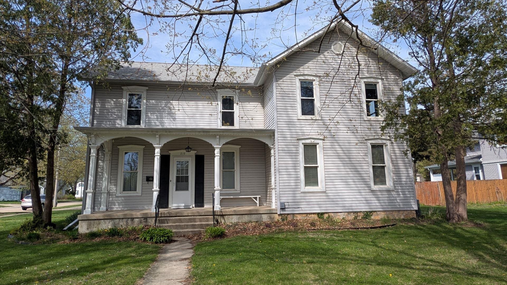 210 South 7th Street Oregon, IL 61061 - Photo 1 of 21 a front view of a house with garden
