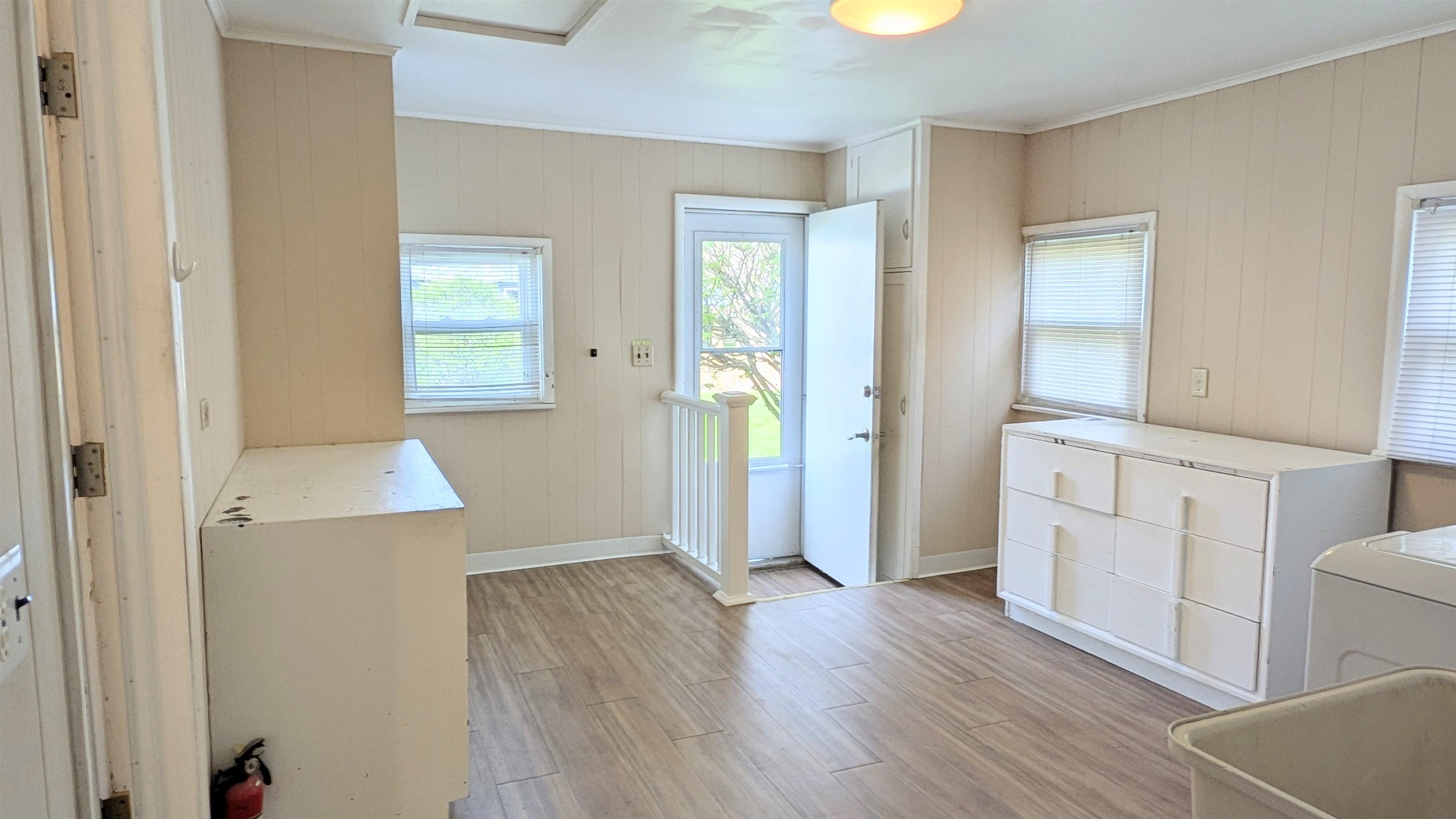 210 South 7th Street Oregon, IL 61061 - Photo 11 of 21 wooden floor in an empty room and a window