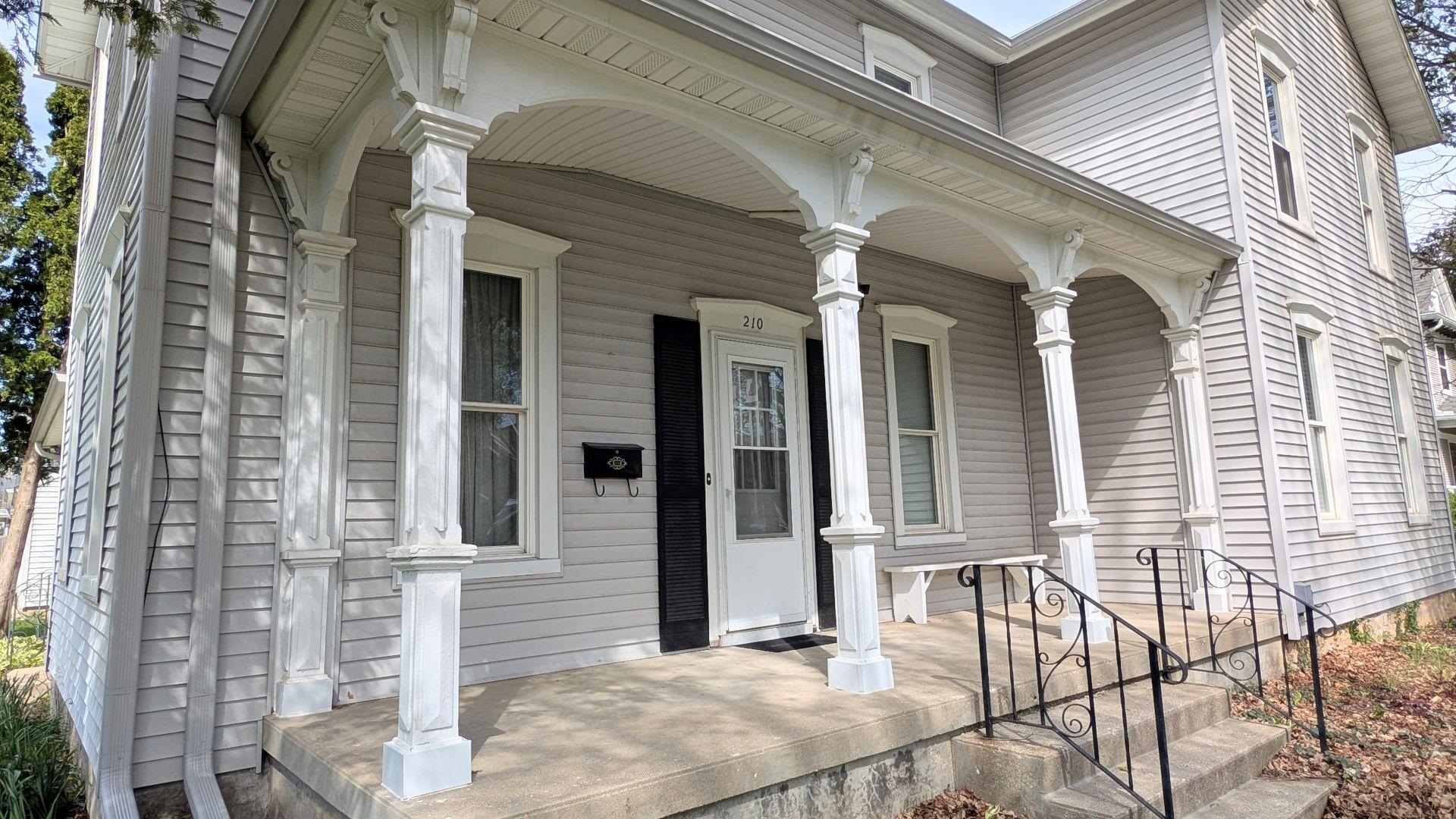 210 South 7th Street Oregon, IL 61061 - Photo 19 of 21 a front view of a house with large windows