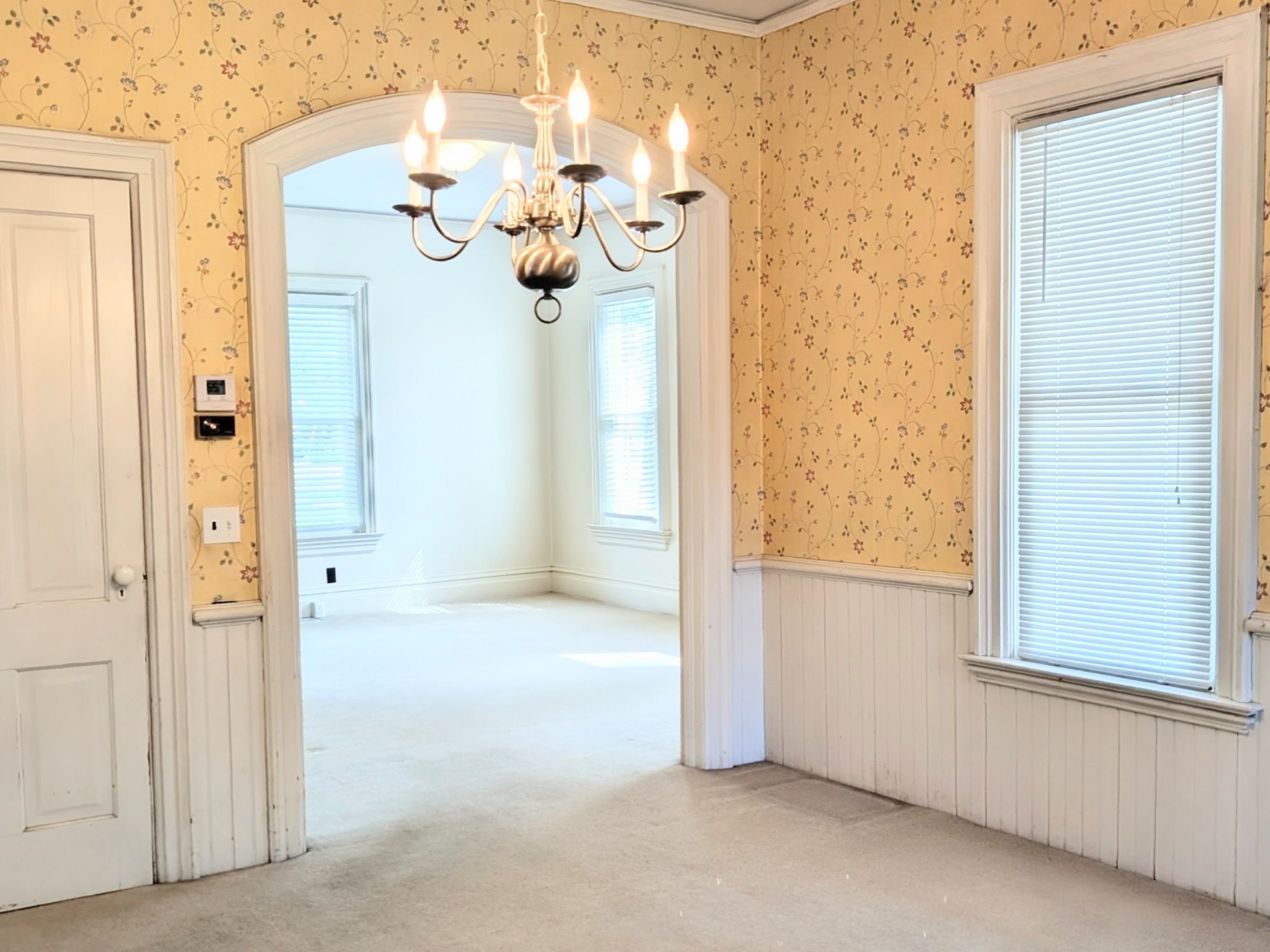 210 South 7th Street Oregon, IL 61061 - Photo 7 of 21 an empty room with windows